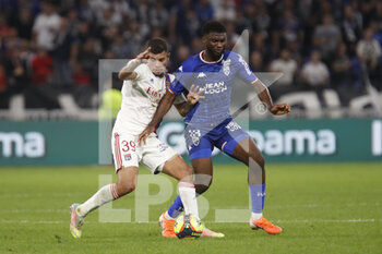 2021-09-25 - Bruno GUIMARAES of Lyon and Terem MOFFI of Lorient during the French championship Ligue 1 football match between Olympique Lyonnais and FC Lorient on September 25, 2021 at Groupama stadium in Decines-Charpieu near Lyon, France - OLYMPIQUE LYONNAIS VS FC LORIENT - FRENCH LIGUE 1 - SOCCER