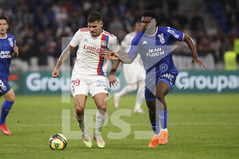 2021-09-25 - Bruno GUIMARAES of Lyon and Terem MOFFI of Lorient during the French championship Ligue 1 football match between Olympique Lyonnais and FC Lorient on September 25, 2021 at Groupama stadium in Decines-Charpieu near Lyon, France - OLYMPIQUE LYONNAIS VS FC LORIENT - FRENCH LIGUE 1 - SOCCER
