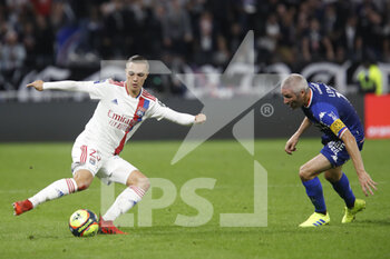 2021-09-25 - Maxence CAQUERET of Lyon and Fabien LEMOINE of Lorient during the French championship Ligue 1 football match between Olympique Lyonnais and FC Lorient on September 25, 2021 at Groupama stadium in Decines-Charpieu near Lyon, France - OLYMPIQUE LYONNAIS VS FC LORIENT - FRENCH LIGUE 1 - SOCCER