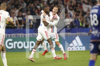 2021-09-25 - Karl TOKO EKAMBI of Lyon score a goal and Maxence CAQUERET of Lyon during the French championship Ligue 1 football match between Olympique Lyonnais and FC Lorient on September 25, 2021 at Groupama stadium in Decines-Charpieu near Lyon, France - OLYMPIQUE LYONNAIS VS FC LORIENT - FRENCH LIGUE 1 - SOCCER