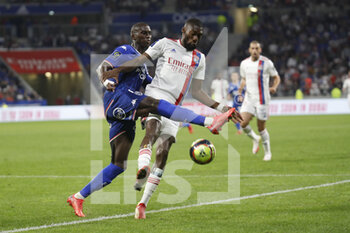 2021-09-25 - Karl TOKO EKAMBI of Lyon and Houboulang MENDES of Lorient during the French championship Ligue 1 football match between Olympique Lyonnais and FC Lorient on September 25, 2021 at Groupama stadium in Decines-Charpieu near Lyon, France - OLYMPIQUE LYONNAIS VS FC LORIENT - FRENCH LIGUE 1 - SOCCER