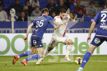 2021-09-25 - Rayan CHERKI of Lyon and Leo PETROT of Lorient during the French championship Ligue 1 football match between Olympique Lyonnais and FC Lorient on September 25, 2021 at Groupama stadium in Decines-Charpieu near Lyon, France - OLYMPIQUE LYONNAIS VS FC LORIENT - FRENCH LIGUE 1 - SOCCER