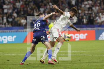 2021-09-25 - Lucas PAQUETA of Lyon and Leo PETROT of Lorient during the French championship Ligue 1 football match between Olympique Lyonnais and FC Lorient on September 25, 2021 at Groupama stadium in Decines-Charpieu near Lyon, France - OLYMPIQUE LYONNAIS VS FC LORIENT - FRENCH LIGUE 1 - SOCCER