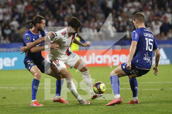 2021-09-25 - Lucas PAQUETA of Lyon and Leo PETROT of Lorient and Julien LAPORTE of Lorient during the French championship Ligue 1 football match between Olympique Lyonnais and FC Lorient on September 25, 2021 at Groupama stadium in Decines-Charpieu near Lyon, France - OLYMPIQUE LYONNAIS VS FC LORIENT - FRENCH LIGUE 1 - SOCCER