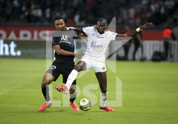 2021-09-25 - Abdou Diallo of PSG, Junior Sambia of Montpellier during the French championship Ligue 1 football match between Paris Saint-Germain (PSG) and Montpellier HSC (MHSC) on September 25, 2021 at Parc des Princes stadium in Paris, France - PARIS SAINT-GERMAIN (PSG) VS MONTPELLIER HSC (MHSC) - FRENCH LIGUE 1 - SOCCER