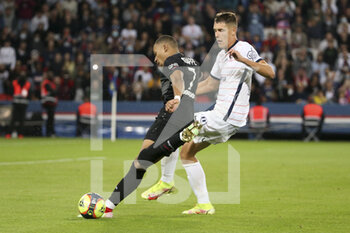 2021-09-25 - Kylian Mbappe of PSG, Maxime Esteve of Montpellier during the French championship Ligue 1 football match between Paris Saint-Germain (PSG) and Montpellier HSC (MHSC) on September 25, 2021 at Parc des Princes stadium in Paris, France - PARIS SAINT-GERMAIN (PSG) VS MONTPELLIER HSC (MHSC) - FRENCH LIGUE 1 - SOCCER