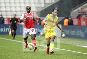 2021-09-26 - Jean-Charles Castelletto of Nantes, Ghislain Konan of Reims (left) during the French championship Ligue 1 football match between Stade de Reims and FC Nantes (FCN) on September 26, 2021 at Stade Auguste Delaune in Reims, France - STADE DE REIMS VS FC NANTES (FCN) - FRENCH LIGUE 1 - SOCCER