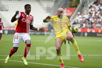 2021-09-26 - Nicolas Pallois of Nantes, N'Dri Philippe Koffi of Reims (left) during the French championship Ligue 1 football match between Stade de Reims and FC Nantes (FCN) on September 26, 2021 at Stade Auguste Delaune in Reims, France - STADE DE REIMS VS FC NANTES (FCN) - FRENCH LIGUE 1 - SOCCER