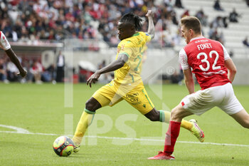 2021-09-26 - Moses Simon of Nantes, Thomas Foket of Reims during the French championship Ligue 1 football match between Stade de Reims and FC Nantes (FCN) on September 26, 2021 at Stade Auguste Delaune in Reims, France - STADE DE REIMS VS FC NANTES (FCN) - FRENCH LIGUE 1 - SOCCER