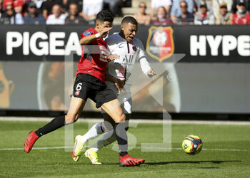 2021-10-03 - Kylian Mbappe of PSG, Nayef Aguerd of Rennes (left) during the French championship Ligue 1 football match between Stade Rennais and Paris Saint-Germain (PSG) on October 3, 2021 at Roazhon Park in Rennes, France - STADE RENNAIS VS PARIS SAINT-GERMAIN (PSG) - FRENCH LIGUE 1 - SOCCER