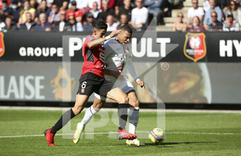 2021-10-03 - Kylian Mbappe of PSG, Nayef Aguerd of Rennes (left) during the French championship Ligue 1 football match between Stade Rennais and Paris Saint-Germain (PSG) on October 3, 2021 at Roazhon Park in Rennes, France - STADE RENNAIS VS PARIS SAINT-GERMAIN (PSG) - FRENCH LIGUE 1 - SOCCER