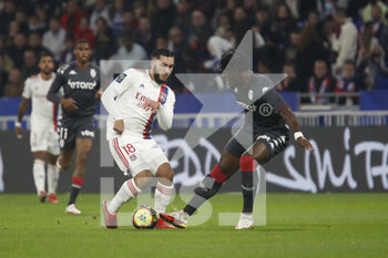 2021-10-16 - Rayan CHERKI of Lyon and Axel DISASI of Monaco during the French championship Ligue 1 football match between Olympique Lyonnais and AS Monaco on October 16, 2021 at Groupama stadium in Decines-Charpieu near Lyon, France - OLYMPIQUE LYONNAIS VS AS MONACO - FRENCH LIGUE 1 - SOCCER