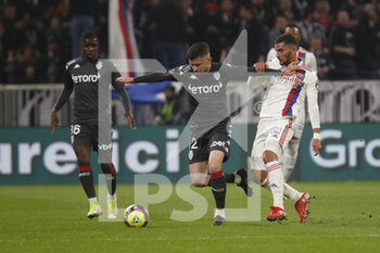 2021-10-16 - Caio HENRIQUE of Monaco and Houssem AOUAR of Lyon during the French championship Ligue 1 football match between Olympique Lyonnais and AS Monaco on October 16, 2021 at Groupama stadium in Decines-Charpieu near Lyon, France - OLYMPIQUE LYONNAIS VS AS MONACO - FRENCH LIGUE 1 - SOCCER