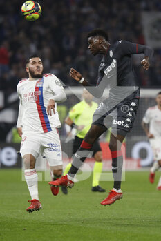 2021-10-16 - Benoit BADIASHILE of Monaco and Rayan CHERKI of Lyon during the French championship Ligue 1 football match between Olympique Lyonnais and AS Monaco on October 16, 2021 at Groupama stadium in Decines-Charpieu near Lyon, France - OLYMPIQUE LYONNAIS VS AS MONACO - FRENCH LIGUE 1 - SOCCER