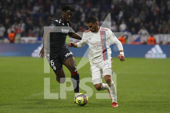 2021-10-16 - Houssem AOUAR of Lyon and Axel DISASI of Monaco during the French championship Ligue 1 football match between Olympique Lyonnais and AS Monaco on October 16, 2021 at Groupama stadium in Decines-Charpieu near Lyon, France - OLYMPIQUE LYONNAIS VS AS MONACO - FRENCH LIGUE 1 - SOCCER