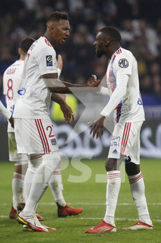 2021-10-16 - Karl Toko EKAMBI of Lyon celebrate the gaol and Jerome BOATENG of Lyon during the French championship Ligue 1 football match between Olympique Lyonnais and AS Monaco on October 16, 2021 at Groupama stadium in Decines-Charpieu near Lyon, France - OLYMPIQUE LYONNAIS VS AS MONACO - FRENCH LIGUE 1 - SOCCER