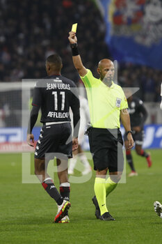 2021-10-16 - Referee Amaury DELERUE yellow card Jean LUCAS of Monaco during the French championship Ligue 1 football match between Olympique Lyonnais and AS Monaco on October 16, 2021 at Groupama stadium in Decines-Charpieu near Lyon, France - OLYMPIQUE LYONNAIS VS AS MONACO - FRENCH LIGUE 1 - SOCCER