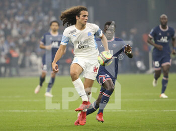 2021-10-24 - Matteo Guendouzi of Marseille, Idrissa Gueye Gana of PSG during the French championship Ligue 1 football match between Olympique de Marseille (OM) and Paris Saint-Germain (PSG) on October 24, 2021 at Stade Velodrome in Marseille, France - OLYMPIQUE DE MARSEILLE (OM) VS PARIS SAINT-GERMAIN (PSG) - FRENCH LIGUE 1 - SOCCER