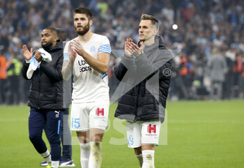 2021-10-24 - Duje Caleta-Car, Arkadiusz Milik of Marseille salute the supporters following the French championship Ligue 1 football match between Olympique de Marseille (OM) and Paris Saint-Germain (PSG) on October 24, 2021 at Stade Velodrome in Marseille, France - OLYMPIQUE DE MARSEILLE (OM) VS PARIS SAINT-GERMAIN (PSG) - FRENCH LIGUE 1 - SOCCER