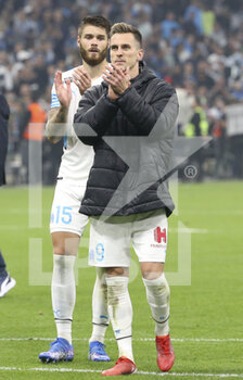 2021-10-24 - Arkadiusz Milik, Duje Caleta-Car (left) of Marseille salute the supporters following the French championship Ligue 1 football match between Olympique de Marseille (OM) and Paris Saint-Germain (PSG) on October 24, 2021 at Stade Velodrome in Marseille, France - OLYMPIQUE DE MARSEILLE (OM) VS PARIS SAINT-GERMAIN (PSG) - FRENCH LIGUE 1 - SOCCER