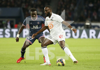 2021-10-29 - Jonathan Ikone of Lille, Idrissa Gueye Gana of PSG (left) during the French championship Ligue 1 football match between Paris Saint-Germain and LOSC Lille on October 29, 2021 at Parc des Princes stadium in Paris, France - PARIS SAINT-GERMAIN VS LOSC LILLE - FRENCH LIGUE 1 - SOCCER