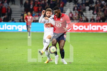 2021-11-06 - Duel BAMBA 7 LOSC and Jimmy CABOT 11 Angers during the French championship Ligue 1 football match between LOSC Lille and SCO Angers on November 6, 2021 at Pierre Mauroy stadium in Villeneuve-d'Ascq near Lille, France - LOSC LILLE VS SCO ANGERS - FRENCH LIGUE 1 - SOCCER