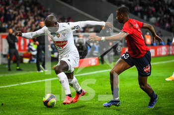 2021-11-06 - Stephane BAHOKEN of Angers and Tiago DJALO of Lille during the French championship Ligue 1 football match between LOSC Lille and SCO Angers on November 6, 2021 at Pierre Mauroy stadium in Villeneuve-d'Ascq near Lille, France - LOSC LILLE VS SCO ANGERS - FRENCH LIGUE 1 - SOCCER