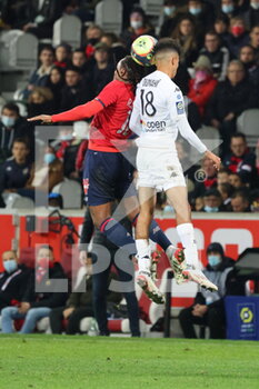 2021-11-06 - On the air Sanches 18 LOSC and OUNAHI Azz-eddine 18 Angers during the French championship Ligue 1 football match between LOSC Lille and SCO Angers on November 6, 2021 at Pierre Mauroy stadium in Villeneuve-d'Ascq near Lille, France - LOSC LILLE VS SCO ANGERS - FRENCH LIGUE 1 - SOCCER