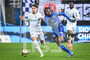 2021-11-21 - Adil AOUCHICHE of Saint Etienne and Rominigue KOUAME of ESTAC Troyes during the French championship Ligue 1 football match between ESTAC Troyes and AS Saint-Etienne on November 21, 2021 at Stade de l'Aube in Troyes, France - ESTAC TROYES VS AS SAINT-ETIENNE - FRENCH LIGUE 1 - SOCCER