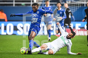 2021-11-21 - Rominigue KOUAME of ESTAC Troyes and Ryad BOUDEBOUZ of Saint Etienne during the French championship Ligue 1 football match between ESTAC Troyes and AS Saint-Etienne on November 21, 2021 at Stade de l'Aube in Troyes, France - ESTAC TROYES VS AS SAINT-ETIENNE - FRENCH LIGUE 1 - SOCCER