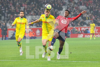 2021-11-27 - Duel Andrei GIROTTO 3 Nantes and Jonathan DAVID 9 LOSC during the French championship Ligue 1 football match between LOSC Lille and FC Nantes on November 27, 2021 at Pierre Mauroy stadium in Villeneuve-d'Ascq near Lille, France - LOSC LILLE VS FC NANTES - FRENCH LIGUE 1 - SOCCER