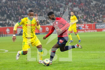 2021-11-27 - Jonathan BAMBA 7 LOSC ans Wylan CYPRIEN 8 Nantes during the French championship Ligue 1 football match between LOSC Lille and FC Nantes on November 27, 2021 at Pierre Mauroy stadium in Villeneuve-d'Ascq near Lille, France - LOSC LILLE VS FC NANTES - FRENCH LIGUE 1 - SOCCER