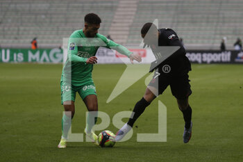 2021-11-28 - Kylian MBAPPE of Paris and Dennis BOUANGA of Saint Etienne during the French championship Ligue 1 football match between AS Saint-Etienne and Paris Saint-Germain on November 28, 2021 at Geoffroy Guichard stadium in Saint-Etienne, France - AS SAINT-ETIENNE (ASSE) VS PARIS SAINT-GERMAIN (PSG) - FRENCH LIGUE 1 - SOCCER