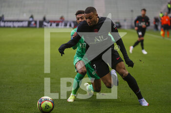 2021-11-28 - Kylian MBAPPE of Paris and Dennis BOUANGA of Saint Etienne during the French championship Ligue 1 football match between AS Saint-Etienne and Paris Saint-Germain on November 28, 2021 at Geoffroy Guichard stadium in Saint-Etienne, France - AS SAINT-ETIENNE (ASSE) VS PARIS SAINT-GERMAIN (PSG) - FRENCH LIGUE 1 - SOCCER