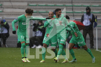 2021-11-28 - Dennis BOUANGA of Saint Etienne celebrate the goal and Wahbi KHAZRI of Saint Etienne and Adil AOUCHICHE of Saint Etienne during the French championship Ligue 1 football match between AS Saint-Etienne and Paris Saint-Germain on November 28, 2021 at Geoffroy Guichard stadium in Saint-Etienne, France - AS SAINT-ETIENNE (ASSE) VS PARIS SAINT-GERMAIN (PSG) - FRENCH LIGUE 1 - SOCCER