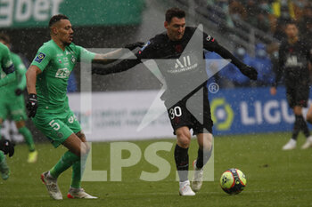 2021-11-28 - Lionel MESSI of Paris and Thimothée KOLODZIEJCZAK of Saint Etienne during the French championship Ligue 1 football match between AS Saint-Etienne and Paris Saint-Germain on November 28, 2021 at Geoffroy Guichard stadium in Saint-Etienne, France - AS SAINT-ETIENNE (ASSE) VS PARIS SAINT-GERMAIN (PSG) - FRENCH LIGUE 1 - SOCCER