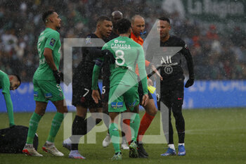 2021-11-28 - NEYMAR Jr of Paris and Mahdi CAMARA of Saint Etienne and Kylian MBAPPE of Paris and Referee Jerome BRISARD during the French championship Ligue 1 football match between AS Saint-Etienne and Paris Saint-Germain on November 28, 2021 at Geoffroy Guichard stadium in Saint-Etienne, France - AS SAINT-ETIENNE (ASSE) VS PARIS SAINT-GERMAIN (PSG) - FRENCH LIGUE 1 - SOCCER