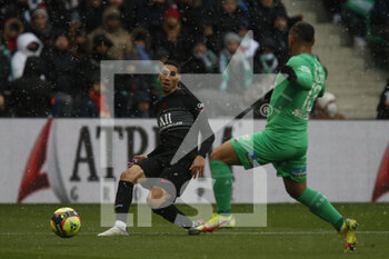 2021-11-28 - Achraf HAKIMI of Paris and Miguel TRAUCO of Saint Etienne during the French championship Ligue 1 football match between AS Saint-Etienne and Paris Saint-Germain on November 28, 2021 at Geoffroy Guichard stadium in Saint-Etienne, France - AS SAINT-ETIENNE (ASSE) VS PARIS SAINT-GERMAIN (PSG) - FRENCH LIGUE 1 - SOCCER