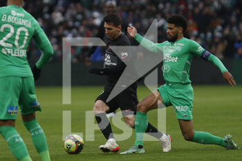 2021-11-28 - Lionel MESSI of Paris and Mahdi CAMARA of Saint Etienne during the French championship Ligue 1 football match between AS Saint-Etienne and Paris Saint-Germain on November 28, 2021 at Geoffroy Guichard stadium in Saint-Etienne, France - AS SAINT-ETIENNE (ASSE) VS PARIS SAINT-GERMAIN (PSG) - FRENCH LIGUE 1 - SOCCER