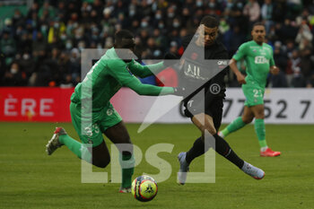2021-11-28 - Kylian MBAPPE of Paris and Mickael NADE of Saint Etienne during the French championship Ligue 1 football match between AS Saint-Etienne and Paris Saint-Germain on November 28, 2021 at Geoffroy Guichard stadium in Saint-Etienne, France - AS SAINT-ETIENNE (ASSE) VS PARIS SAINT-GERMAIN (PSG) - FRENCH LIGUE 1 - SOCCER