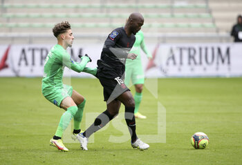 2021-11-28 - Danilo Pereira of PSG, Adil Aouchiche of Saint-Etienne (left) during the French championship Ligue 1 football match between AS Saint-Etienne (ASSE) and Paris Saint-Germain (PSG) on November 28, 2021 at Stade Geoffroy Guichard in Saint-Etienne, France - AS SAINT-ETIENNE (ASSE) VS PARIS SAINT-GERMAIN (PSG) - FRENCH LIGUE 1 - SOCCER