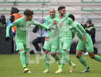 2021-11-28 - Denis Bouanga of Saint-Etienne (right) celebrates his goal with Adil Aouchiche, Wahbi Khazri during the French championship Ligue 1 football match between AS Saint-Etienne (ASSE) and Paris Saint-Germain (PSG) on November 28, 2021 at Stade Geoffroy Guichard in Saint-Etienne, France - AS SAINT-ETIENNE (ASSE) VS PARIS SAINT-GERMAIN (PSG) - FRENCH LIGUE 1 - SOCCER