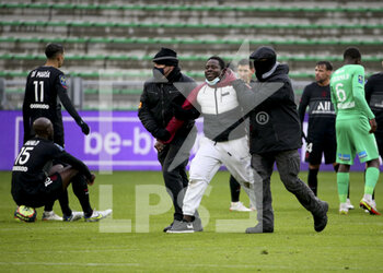 2021-11-28 - Pitch invader removed by security during the French championship Ligue 1 football match between AS Saint-Etienne (ASSE) and Paris Saint-Germain (PSG) on November 28, 2021 at Stade Geoffroy Guichard in Saint-Etienne, France - AS SAINT-ETIENNE (ASSE) VS PARIS SAINT-GERMAIN (PSG) - FRENCH LIGUE 1 - SOCCER