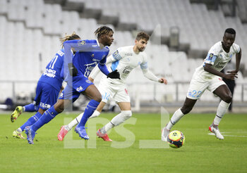 2021-11-28 - Rominigue Kouame of Troyes, Luan Peres, Pape Gueye of Marseille during the French championship Ligue 1 football match between Olympique de Marseille and ESTAC Troyes on November 28, 2021 at Orange Velodrome stadium in Marseille, France - OLYMPIQUE DE MARSEILLE VS ESTAC TROYES - FRENCH LIGUE 1 - SOCCER