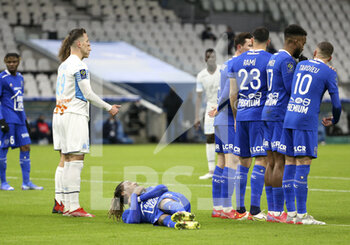 2021-11-28 - Gerson Rodrigues of Troyes lies down to form the wall of Troyes on a free kick for Marseille during the French championship Ligue 1 football match between Olympique de Marseille and ESTAC Troyes on November 28, 2021 at Orange Velodrome stadium in Marseille, France - OLYMPIQUE DE MARSEILLE VS ESTAC TROYES - FRENCH LIGUE 1 - SOCCER