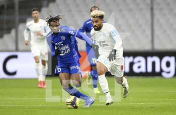 2021-11-28 - Rominigue Kouame of Troyes, Konrad De La Fuente of Marseille during the French championship Ligue 1 football match between Olympique de Marseille and ESTAC Troyes on November 28, 2021 at Orange Velodrome stadium in Marseille, France - OLYMPIQUE DE MARSEILLE VS ESTAC TROYES - FRENCH LIGUE 1 - SOCCER