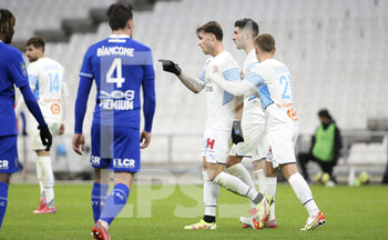 2021-11-28 - Pol Lirola of Marseille celebrates his goal with teammates during the French championship Ligue 1 football match between Olympique de Marseille and ESTAC Troyes on November 28, 2021 at Orange Velodrome stadium in Marseille, France - OLYMPIQUE DE MARSEILLE VS ESTAC TROYES - FRENCH LIGUE 1 - SOCCER