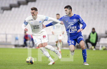 2021-11-28 - Arkadiusz Milik of Marseille, Xavier Chevalerin of Troyes during the French championship Ligue 1 football match between Olympique de Marseille and ESTAC Troyes on November 28, 2021 at Orange Velodrome stadium in Marseille, France - OLYMPIQUE DE MARSEILLE VS ESTAC TROYES - FRENCH LIGUE 1 - SOCCER