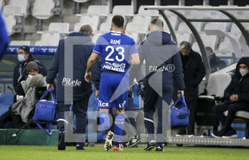 2021-11-28 - Adil Rami of Troyes leaves the pitch because of an injury during the French championship Ligue 1 football match between Olympique de Marseille and ESTAC Troyes on November 28, 2021 at Orange Velodrome stadium in Marseille, France - OLYMPIQUE DE MARSEILLE VS ESTAC TROYES - FRENCH LIGUE 1 - SOCCER