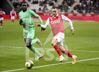 2021-12-11 - Anastasios Donis of Reims, Mickael Nade of Saint-Etienne (left) during the French championship Ligue 1 football match between Stade de Reims and AS Saint-Etienne (ASSE) on December 11, 2021 at Stade Auguste Delaune in Reims, France - STADE DE REIMS VS AS SAINT-ETIENNE (ASSE) - FRENCH LIGUE 1 - SOCCER